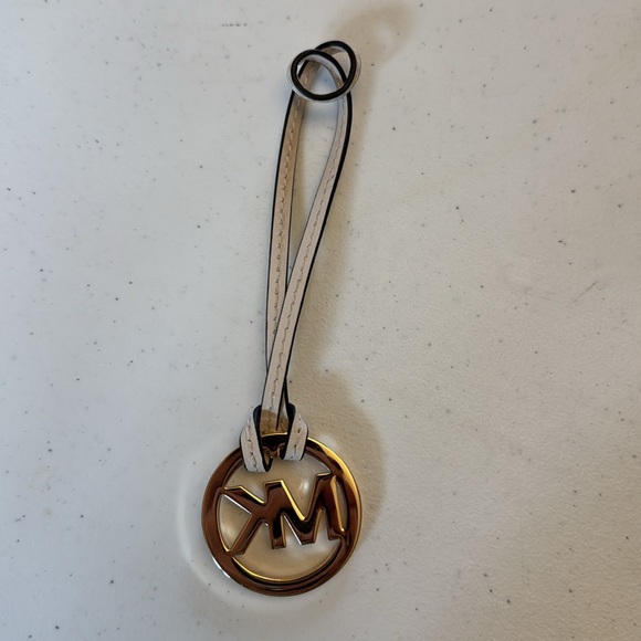 Michael Kors hang tag, gold with ivory leather strap. Approx 6” x 1.75” - Picture 2 of 5